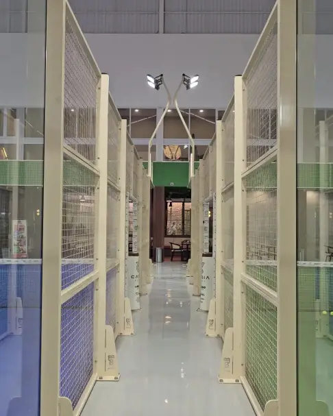 The bright aisle between courts