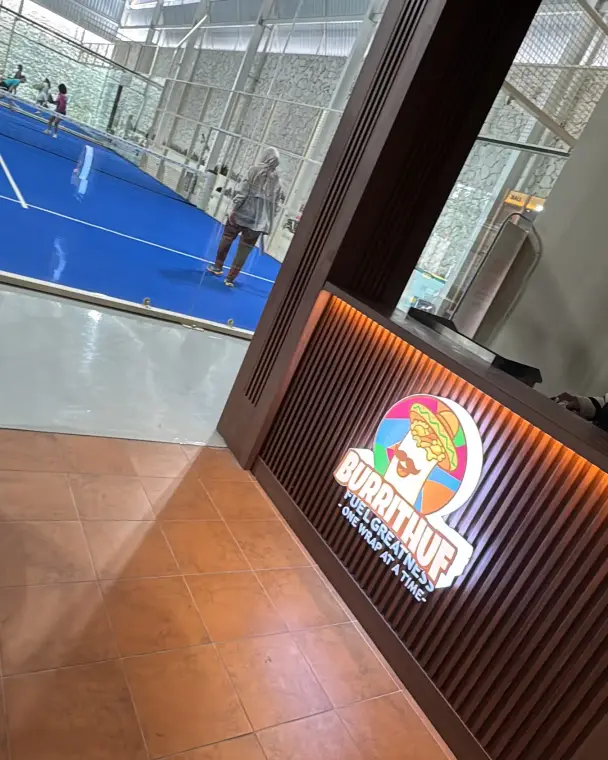 Courtside with the blue court beyond
